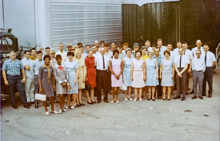 Vintage group photo of SCT employees outside the facility