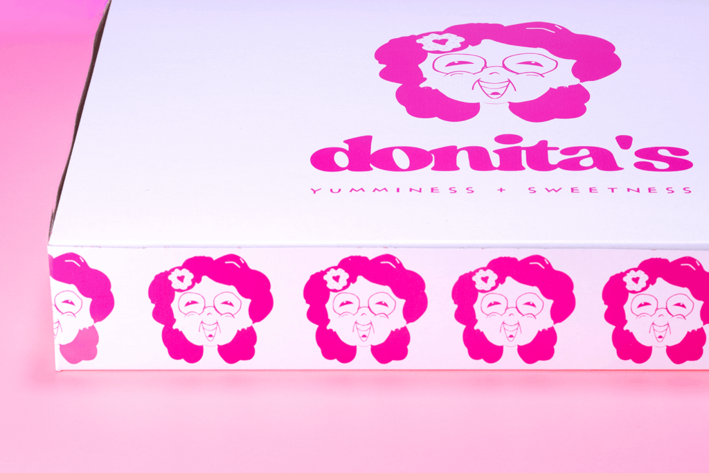 Custom printed bakery box with swirl branding and tagline